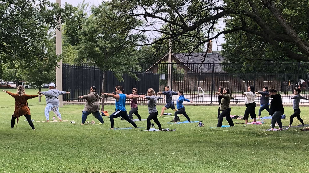 people doing yoga outdoors